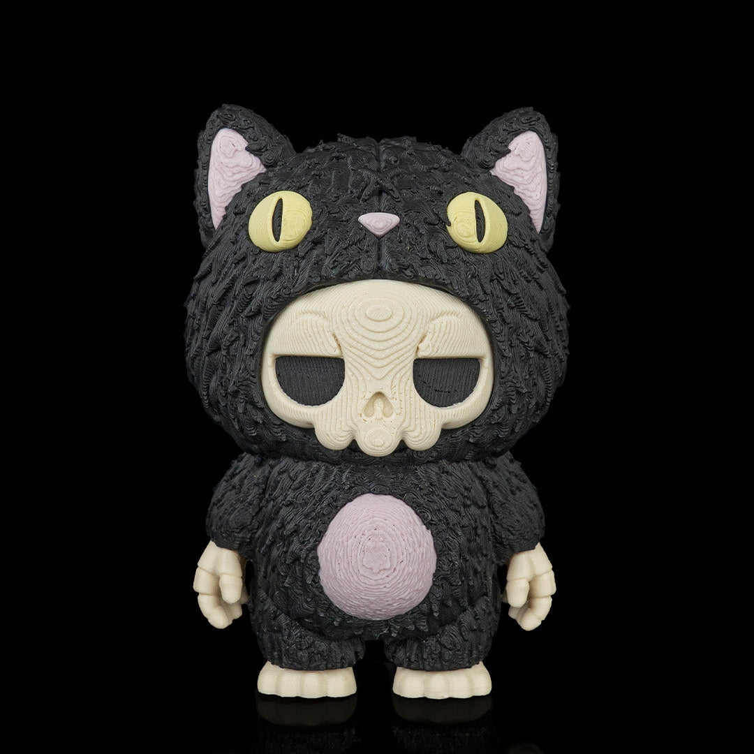A stylized black cat figure with a textured fur-like surface, cream-colored skull face, yellow eyes, pink inner ears, and a pink circular patch on the belly, standing against a black background.