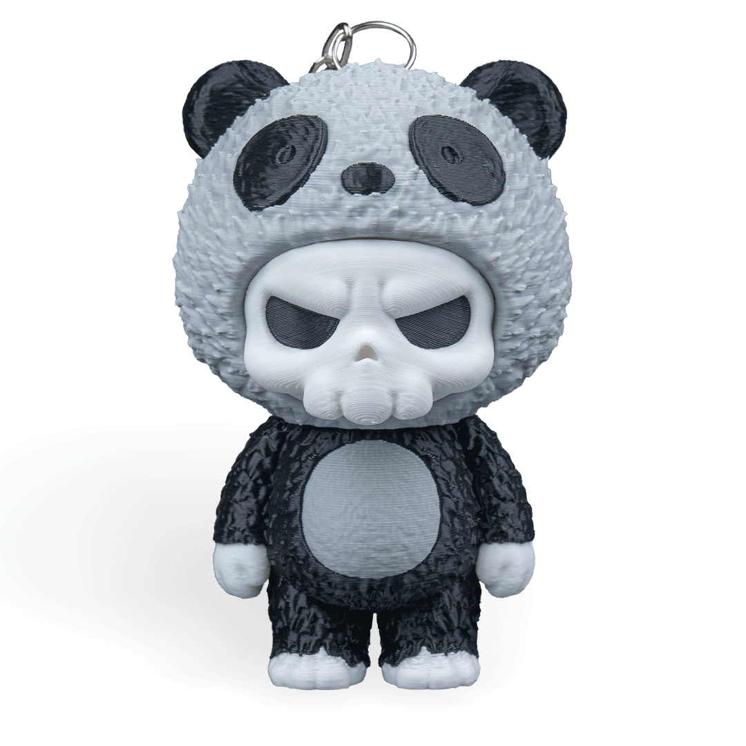 3D printed keychain in the shape of a panda with a skull design on a white background