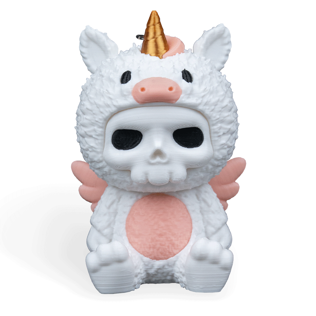Unicorn-shaped toy with a gold horn and pink accents on a white background